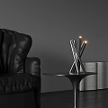 Modern Metal Table Lamp With Lit Lights On Round Side Table By Black Leather Sofa In Gray Background