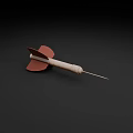 Two Darts With Red Flights Wooden Shafts And Metal Tips On Dark Background