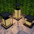 Three Abstract Floor Lamps Featuring Geometric Pattern Shades Outdoor Green Hedge Stone Pavement