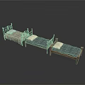 Vintage Style Beds With Ornate Metal And Wooden Frames And Patterned Blue Mattresses