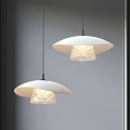 Two Modern White Pendant Lights With Transparent Textured Shades Illuminated In Interior