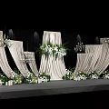 Modern Wedding Banquet Hall With White Curtains Floral Arrangements And Chandeliers On Stage