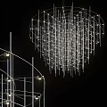 Artistic Modern Metal Chandelier With Hanging Rods In Contemporary Interior Space