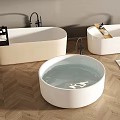 Beige And White Freestanding Bathtubs With Black Faucets On Herringbone Wooden Floor And Slippers