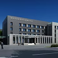 Modern Office Building Exterior With Multiple Windows Entrance And People Standing