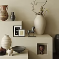 Stylish Ceramic Vessels on Shelf with Metallic Horse Figurine Photo Frames and Wall Decor