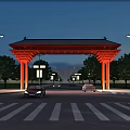 Red Traditional Entrance Gate Illuminated at Night With Trees Street Lamps and Passing Cars
