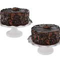 Delicious Chocolate Cakes On White Cake Stands With Chocolate Shavings And Decorative Toppings