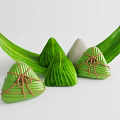 Traditional Chinese Zongzi Wrapped in Green Leaves with Decorative Leaf Accents