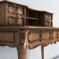 Vintage Wooden Desk With Carved Legs Drawers And Shelf Against Gray Brick Wall