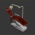 Red Upholstered Dental Examination Chair With White Frame And Overhead Light