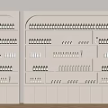 Beige Display Shelves Filled With Various Colored Bottles And Bottom Cabinets