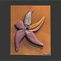 Pink Starfish Decorative Wall Art on Orange Wooden Board with Colorful Details