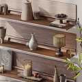 Stylish Decorative Ornament Collection On Wooden Shelves With Vase Candle Holder And Green Plant