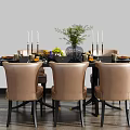 Modern Round Dining Table Set With Light Brown Chairs Green Plant Candles And Tableware
