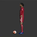 Man Standing in Red Liverpool Jersey Number 4 With Football at His Feet