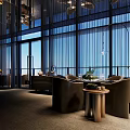 Elegant Modern Restaurant Interior Featuring Large Windows Comfortable Sofa Seats Pendant Lights And Green Plants