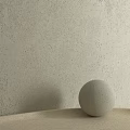Circular Spherical Component On Light Colored Surface With Beige Rough Textured Wall