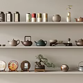 Traditional Ceramic Tea Set Display On Shelves With Various Teapots Storage Jars And Decorative Plates