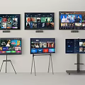 Multiple TVs Displaying Streaming Content On Wall And Stand Mounted Screens