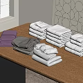 Folded Colorful Towels In Purple Grey White Tones Arranged On Wooden Table