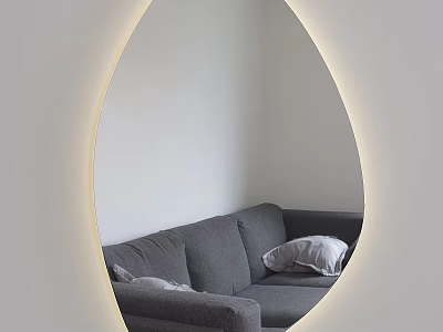 Oval Mirror with Lighted Edge Reflecting Gray Sofa and Pillows in White Wall Interior 3d model