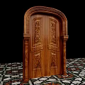 Wooden Double Doors With Intricate Carvings Flanked By Decorative Columns And Colorful Geometric Floor Tiles