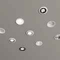Modern Downlights and Spotlights Arranged on Gray Ceiling for Indoor Lighting
