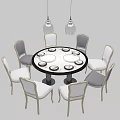 Modern Round Dining Table Set With White And Gray Chairs And Hanging Pendant Lights