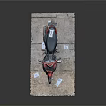 Red And Black Motorcycle Displayed On Platform With Small Tags