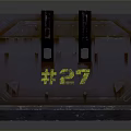 Dark Colored Industrial Metal Crate With Yellow Markings Number 27 And Handles