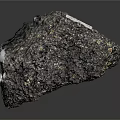 Natural Black Wood Stone With Golden Spots And Label On Dark Background