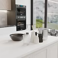 Modern Kitchen Interior With White Counter Black Bowl Glass Vases And Oven View