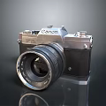 Canon Vintage Camera With Silver Black Body And Lens On Reflective Surface