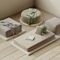 Light Colored Minimalist Cushions Ottomans With Blankets Pillows And Small Book On Wooden Floor