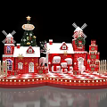 Christmas Themed Decoration Scene With Red Buildings Windmills Snowmen And Reindeer