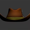 Orange Cowboy Hat With Yellow Band And Decorative Emblem On Gray Background