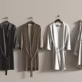Various Colored Bathrobes Hanging On Wall As Soft Bathroom Accessories
