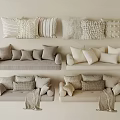Neutral Toned Sofas With Various Textured Pillows And Throw Blankets
