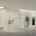 Modern Clothing Store Interior With Arched Windows Hanging Clothes And Plant Decor