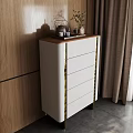 Modern Chest of Drawers with Upholstered Front Gold Accents Wooden Tray Teapot Plant on Top