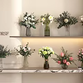 X DDRSF Lit Shelves With Flower Vases And White Pink Green Flowers On Marble Countertop