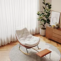 Cozy White Padded Wooden Rocking Chair With Footstool By Window On Grey Rug With Green Plant