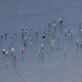 Many People Gathering In Open Area With Different Colored Clothing And Spacious Ground