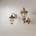 Vintage Gold Wall Sconces With Intricate Patterns And Glass Shades On White Wall