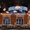 Chinese Style Restaurant Interior Featuring Jellyfish Shaped Chandeliers Brown Walls And Aquariums