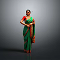 Woman In Green Saree With Red Borders Standing Against Dark Background