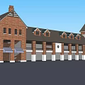 Brick Commercial Street With Multiple Shops Gabled Roofs And Storefront Awnings