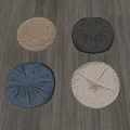 Four Round Decorative Floor Cushions In Woven And Fabric Materials With Assorted Colors