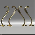 Golden Carved Decorative Pieces With Intricate Curved Designs And Ornate Patterns